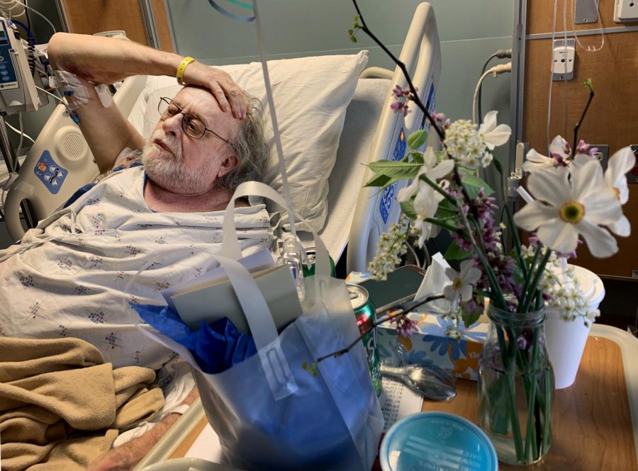 John Diamond, 71, of Carbondale, watches television on Sunday, April 14, 2019, in his room at Carbondale Memorial Hospital in Carbondale, Illinois. Diamond was shot by a stray bullet at Tres Hombres Mexican Restaurant and Bar on Friday. 