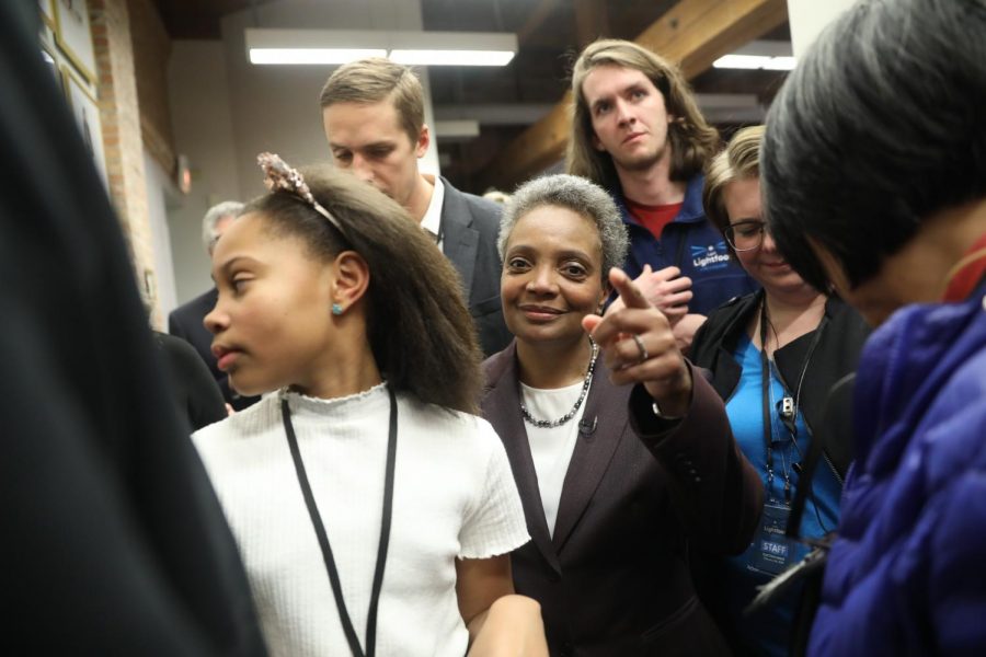 Mayoral candidate Lori Lightfoot and her daughter Vivian Lightfoot appear with supporters Tuesday night, Feb. 26, 2019 at EvolveHer in Chicago.