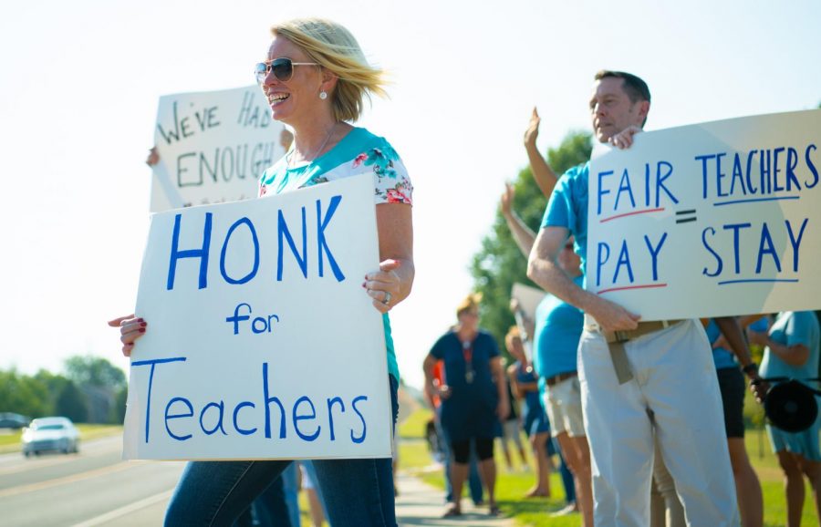 Special Educator Jennifer Bunton, of Murphysboro, rallies for fair contracts on Monday, Sept. 9, 2019 outside the Carbondale Middle School. I am out here because I want a fair contract, Bunton said. 
