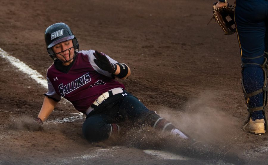 Saluki outfielder Aubree Depron slides into home base on Saturday, Sept. 21, 2019 during the Salukis 4-0 win against the Murray State Racers at Charlotte West Stadium.