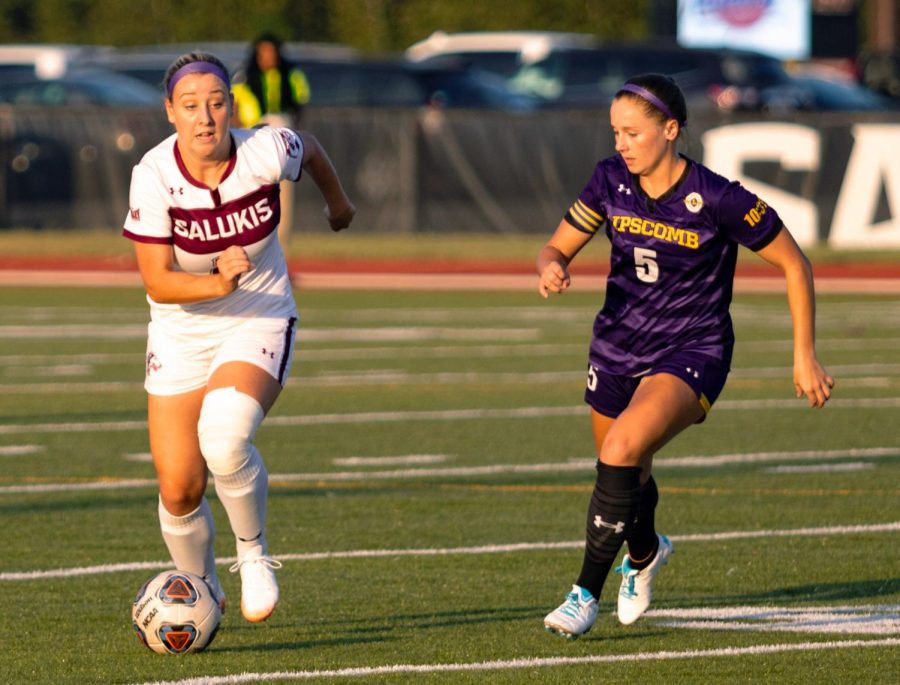 Saluki freshman Madison Bennion pushes the ball forward on Thursday, Sept. 19, 2019 during their 0-6 loss against the Lipscomb Bisons at the Lew Hartzog Track & Field Complex.