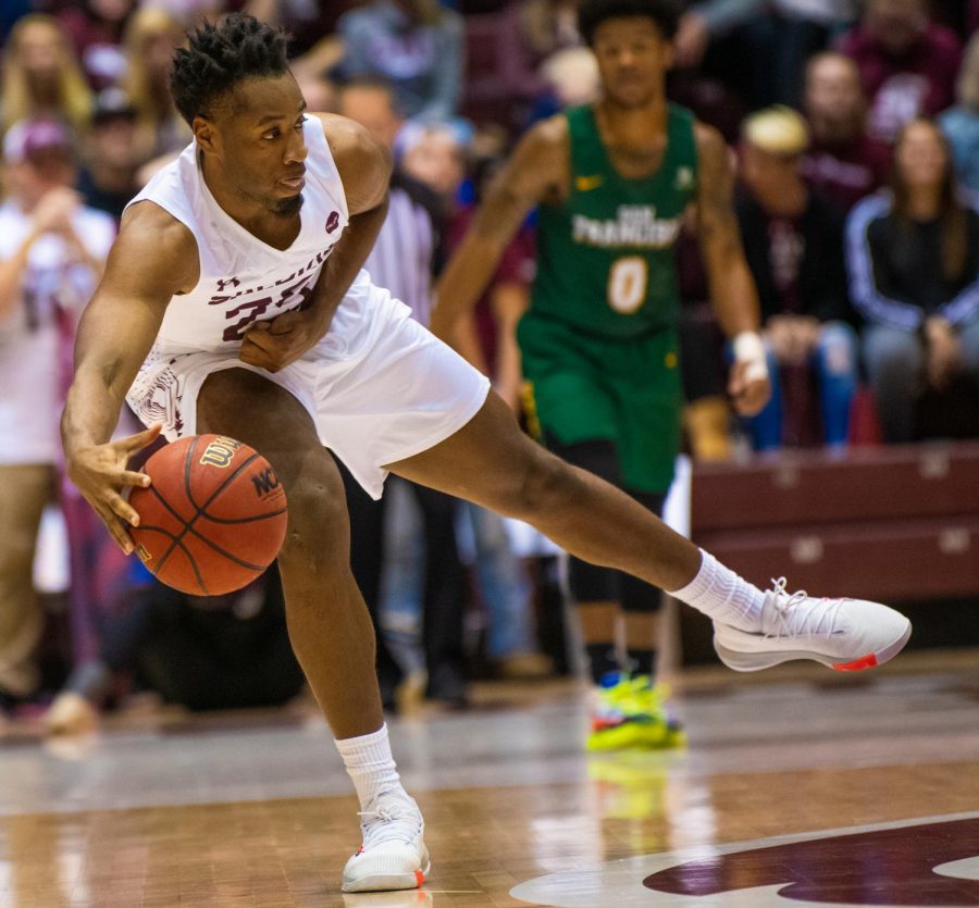 Junior forward Brendon Gooch passes the ball on Saturday, Nov. 16, 2019 during the Salukis 60-76 loss to the San Francisco Dons inside the Banterra Center.   
