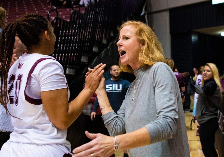 Athletic+Director+Liz+Jarnigan+congratulates+players+after+the+game+on+Saturday%2C+Nov.+16%2C+2019+after+the+Salukis+76-65+win+against+the+Tennessee+Tech+University+Golden+Eagles.+