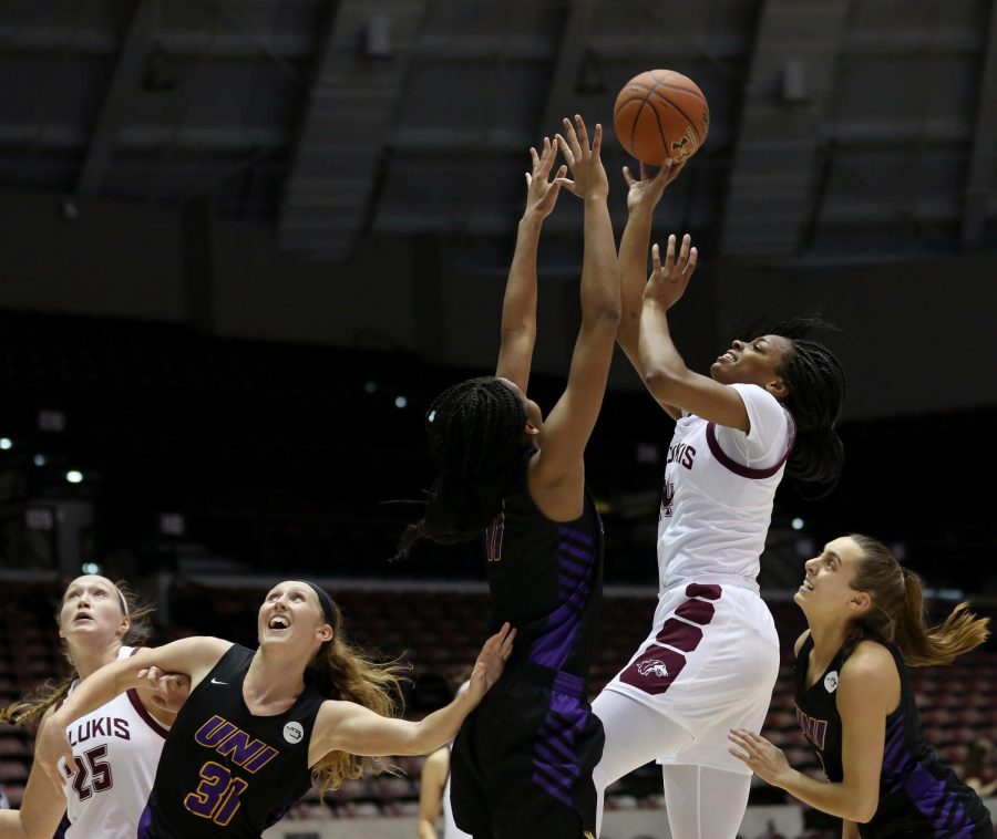 Saluki forward Nicole Martin is about to release the ball, just past the reach of Panthers forward Bre Gunnels on Friday, January 10, 2020, during the Salukis 60-57 loss to the Northern Iowa Panthers inside the Banterra Center.