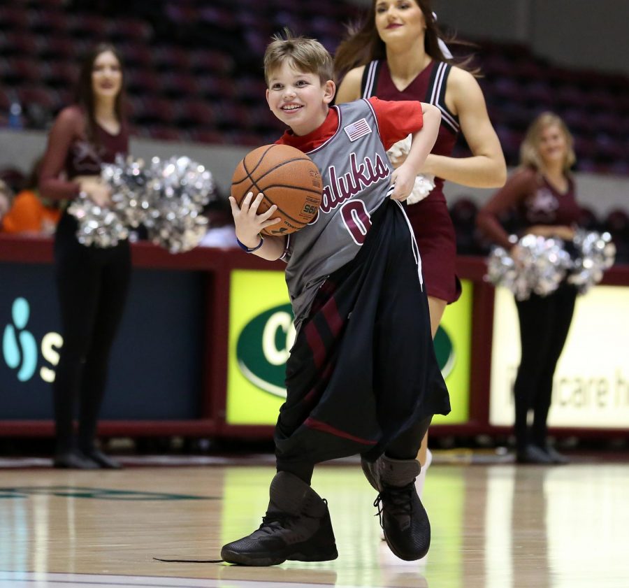 Ten-year-old Wyatt Koth, of Carterville, participates in half-time fun on Friday, January 10, 2020, during the Salukis 60-57 loss to the Northern Iowa Panthers inside the Banterra Center.