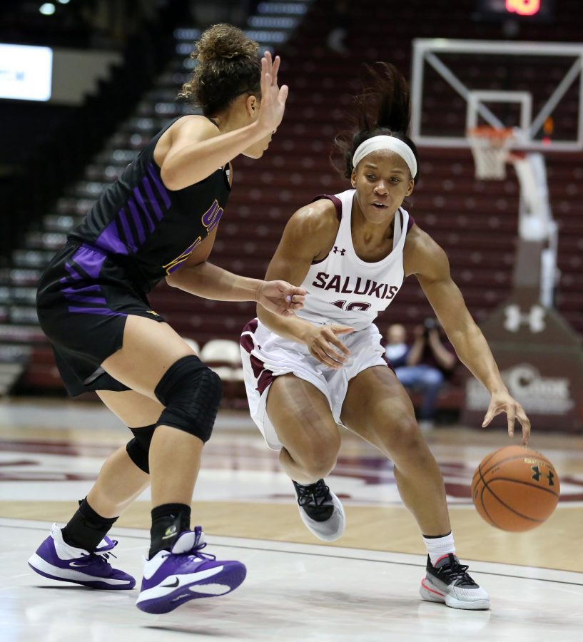 Saluki guard Brittney Patrick moves the ball past Panthers guard Kam Finley on Friday, January 10, 2020, during the Salukis 60-57 loss to the Northern Iowa Panthers inside the Banterra Center.