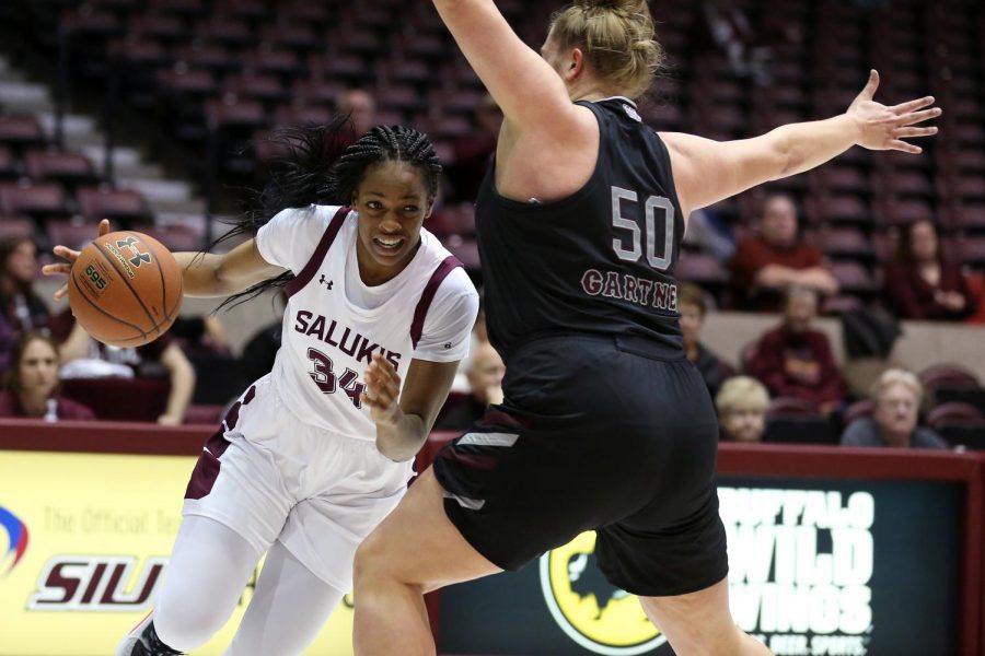 Saluki forward Nicole Martin gets around the defense of Lady Bears center Emily Gartner on Friday, January 17, 2020, during the Salukis dramatic 70-68 victory over the Missouri State Lady Bears inside the Banterra Center.