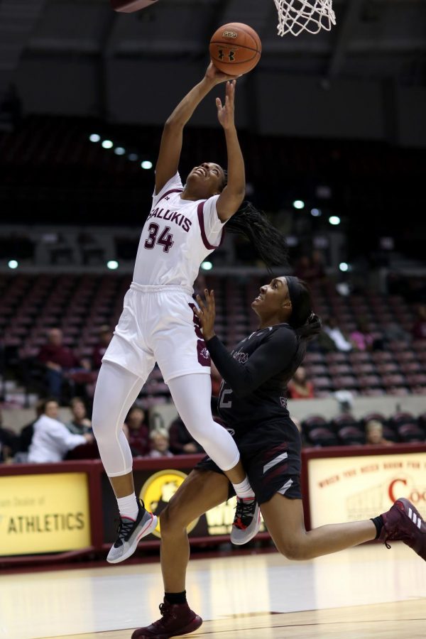 Saluki forward Nicole Martin goes up for two and is fouled from behind by Lady Bears forward Jasmine Franklin on Friday, January 17, 2020, during the Salukis dramatic 70-68 victory over the Missouri State Lady Bears at the Banterra Center.