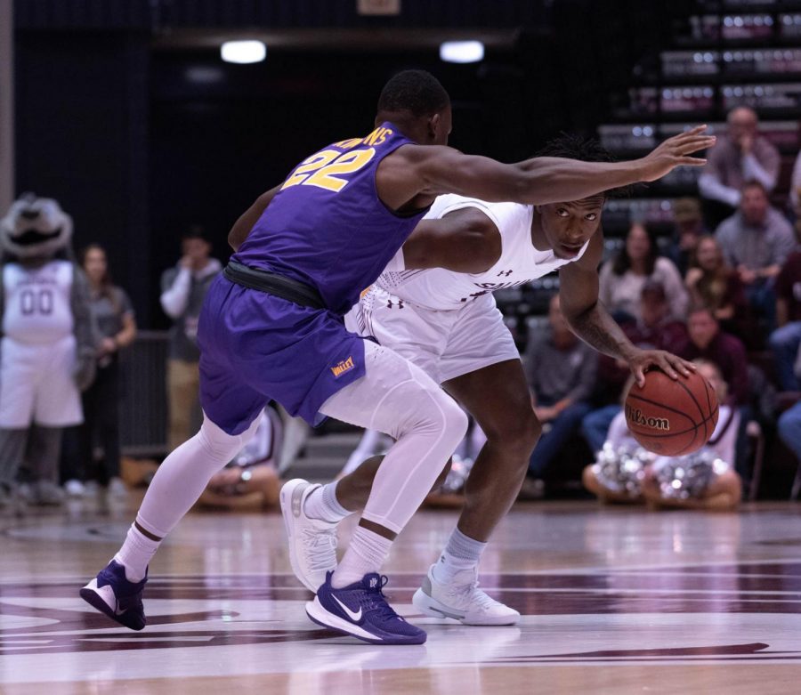 Southern Illinois Universitys Freshman gurd Lance Jones defends the ball from University of Nothern Iowas Freshman guard Antwan Kimmons  during the Wednesday January 22, 2020 game in SIUs Bantera Arena. The game ended at 68 SIU and 66 UNI.