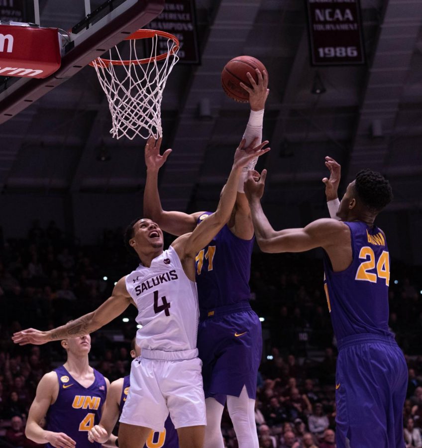 Southern Illinois Universitys Senior guard Eric McGill defends the hoop from University of Nothern Iowas Junior Guard Trae Berhow and Senior guard Isaiah Brown during the Wednesday January 22, 2020 game in SIUs Bantera Arena. The game ended at 68 SIU and 66 UNI.