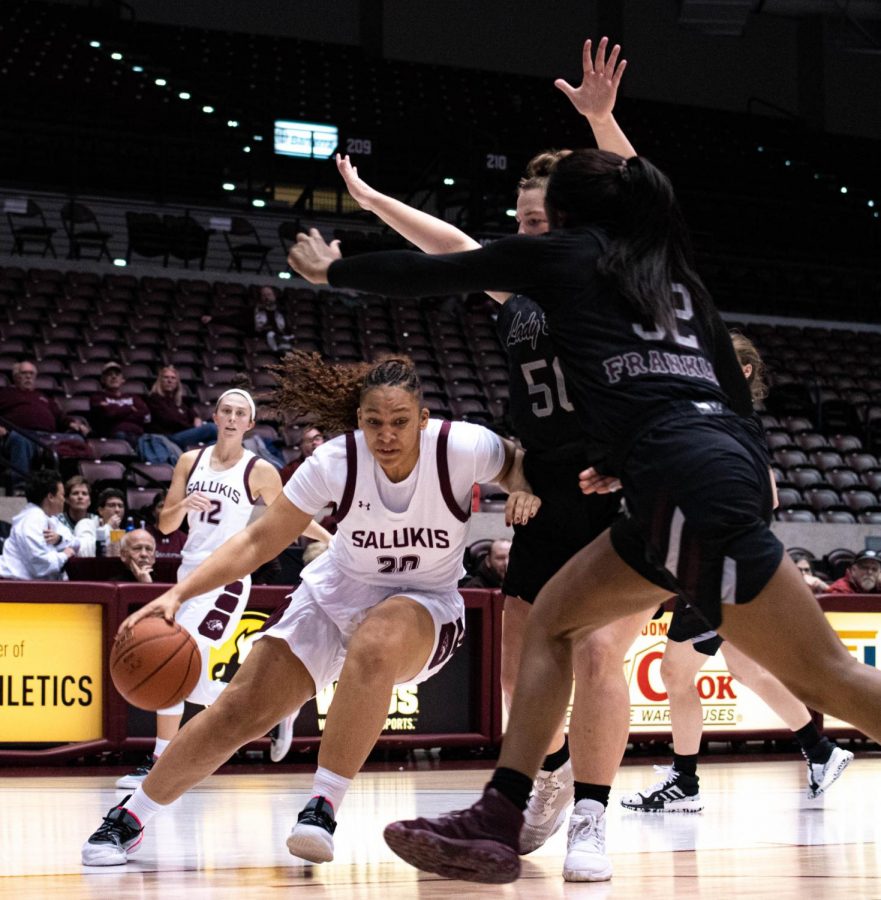 Southern Illinois Salukis Junior Forward, Gabby Walker, protects the ball from Missouri State Bears Junior center, Emily Gartner, and Sophmore forward, Jasmine Franklin, during the Friday evening Womans Basketball game ending the game with Salukis taking the win 70 to 64 at the Bantera Arena on January 17, 2020.