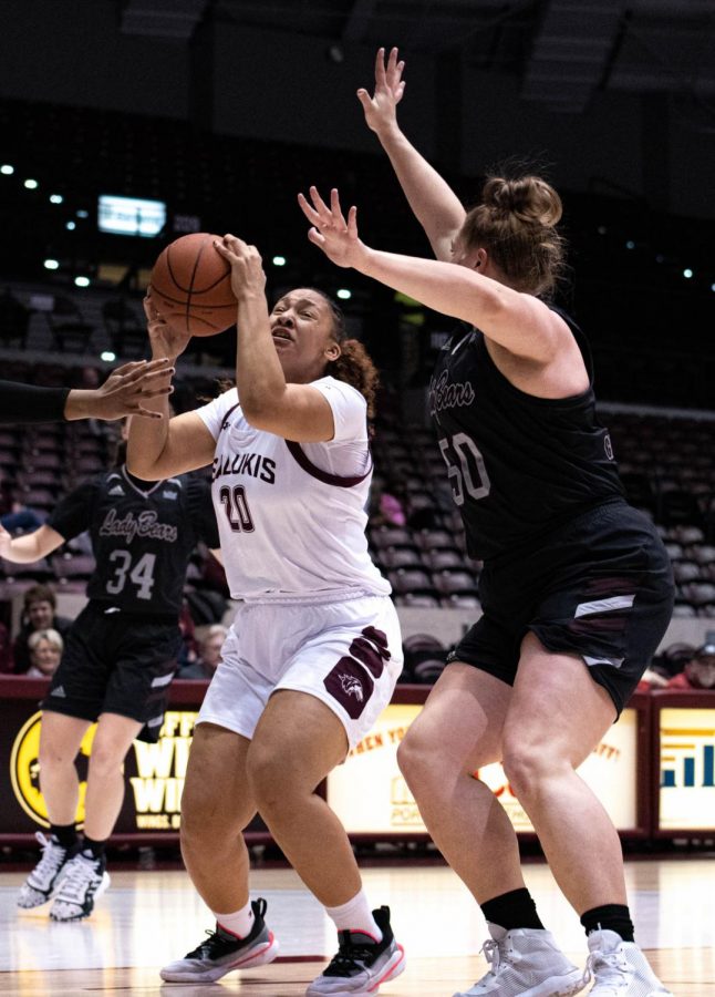 Southern Illinois Salukis Junior Forward, Gabby Walker, goes for a basket while Missouri State Bears Junior center, Emily Gartner, blocks during the Friday evening Woman's Basketball game ending the game with Salukis taking the win 70 to 64 at the Bantera Arena on January 17, 2020.