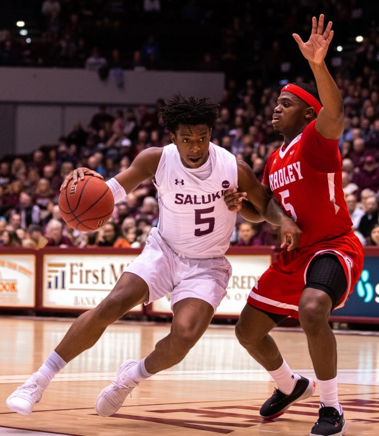 Saluki guard Lance Jones drives towards the basket as he handles a Braves’ defender during Saturday’s home 67-69 loss to Bradley on  Feb. 15, 2020 at the Banterra Center.
