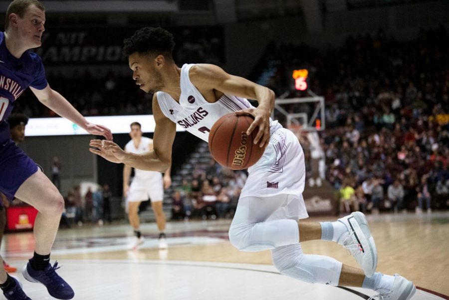 Southern Illinois University Saluki number three guard, Ronnie Suggs, runs to make a basket during the basketball game against the Evansville Purple Aces in the SIU Banterra Center. The game ended 53 to 70 with SIU taking the win on Thursday night, February 20, 2020.