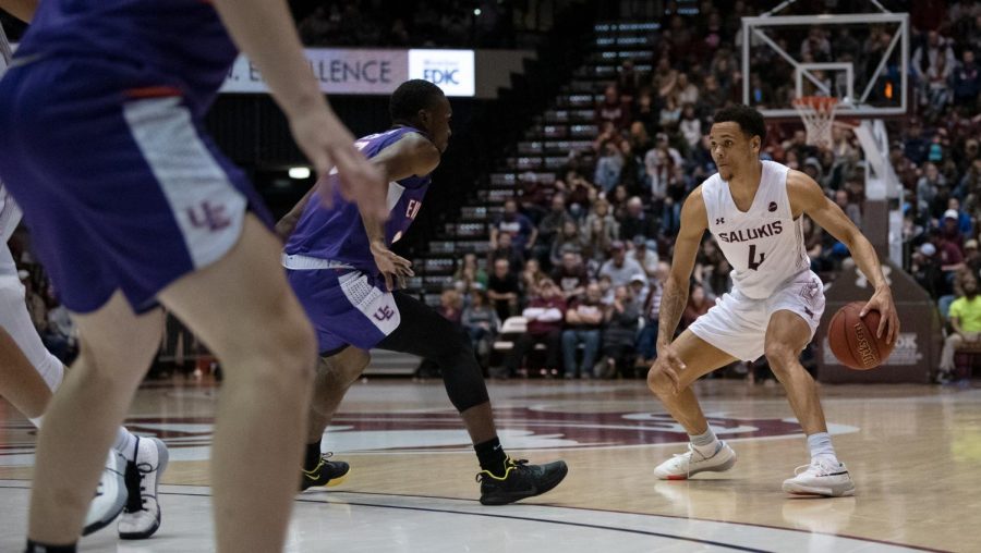 Southern Illinois University Saluki number four guard, Eric McGill, defend the ball during the basketball game against the Evansville Purple Aces in the SIU Banterra Center. The game ended 53 to 70 with SIU taking the win on Thursday night, February 20, 2020.