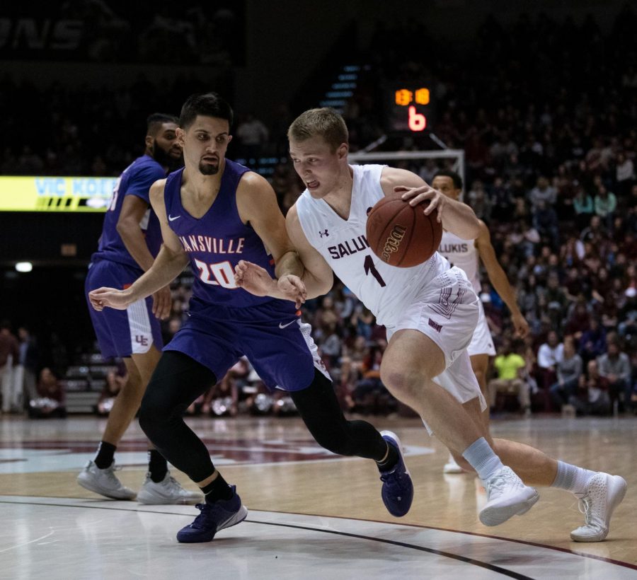 Southern Illinois University Saluki number one forward, Marcus Domask, protects the ball during the basketball game against the Evansville Purple Aces in the SIU Banterra Center. The game ended 53 to 70 with SIU taking the win on Thursday night, February 20, 2020.