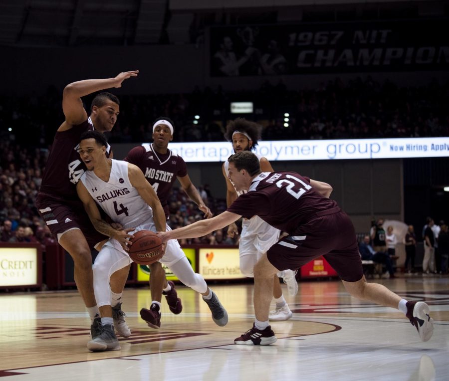 Southern Illinois University Saluki number four, Eric McGill, Guard, defended the ball from the Missouri State Bears during the Saturday night game at the SIU Banterra Center ending the game with Mo State 66 to SIU 68 on February 8, 2020.