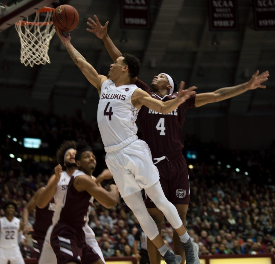 Southern Illinois University Saluki number four, Eric McGill, Guard, went for a basket and scored against Missouri State Bears during the Saturday night game at the SIU Banterra Center ending the game 66 to 68 with SIU Salukis taking the win on Feb. 8, 2020.