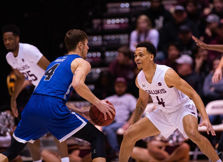 Salukis guard Eric McGill takes on a Sycamore guard during SIU’s Senior Night. SIU would go on to loss to Indiana State 77-68 on Wednesday, Feb. 26, 2020 at the Banterra Center.  Jared Treece @bisalo