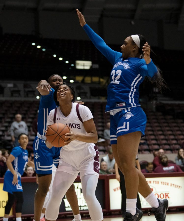 Southern Illinois Saluki number 34 forward, Nicole Martin, aims for a basket against Indiana State Sycamores during the Friday night woman’s basketball game at the SIU Banterra Center. The game ended with SIU at 60 and ISU at 42 on February 21, 2020.