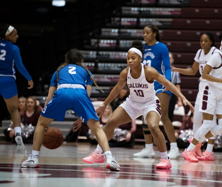 Southern Illinois Saluki number 10 guard, Brittney Patrick, fights to get the ball from Indiana State Sycamores during the Friday night woman’s basketball game at the SIU Banterra Center. The game ended with SIU at 60 and ISU at 42 on February 21, 2020.