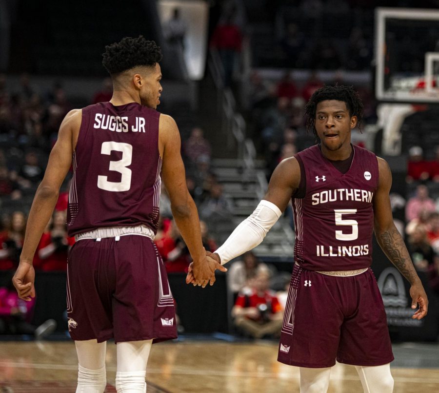 Ronnie Suggs Jr. (left) shows support for Lance Jones (right) against Bradley as the  Salukis would go onto lose 59-64 to Bradley on Friday, Mar. 6, 2020 at the Enterprise Center in St. Louis, MO.