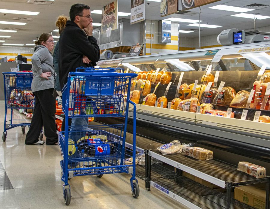 People wait in lines to buy food and supplies as the hysteria surrounding COVID-19 spreads on Sunday, Mar. 15, 2020 at Meijer in Springfield, IL. 