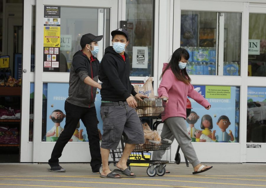 Shoppers leave Kroger supermarket, Carbondale, IL, Saturday, April 4, 2020.  Some shoppers opted to wear medical masks to help protect against the Covid-19 pandemic.