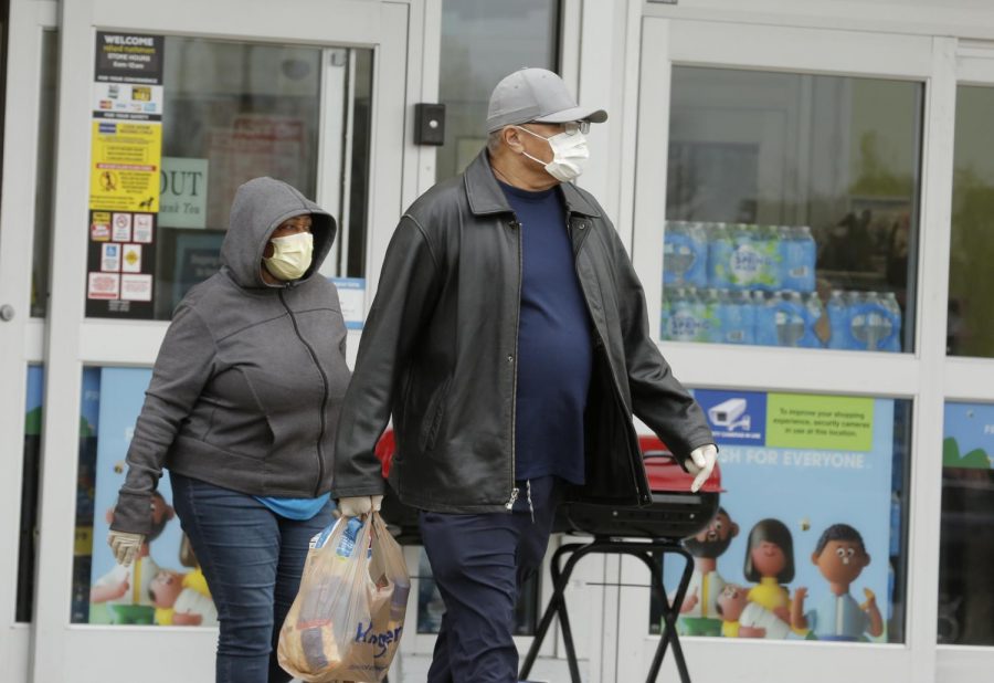 Shoppers leave Kroger supermarket, Carbondale, IL, Saturday, April 4, 2020.  Some shoppers opted to wear medical masks to help protect against the Covid-19 pandemic.




(Angel Chevrestt, 646.314.3206)