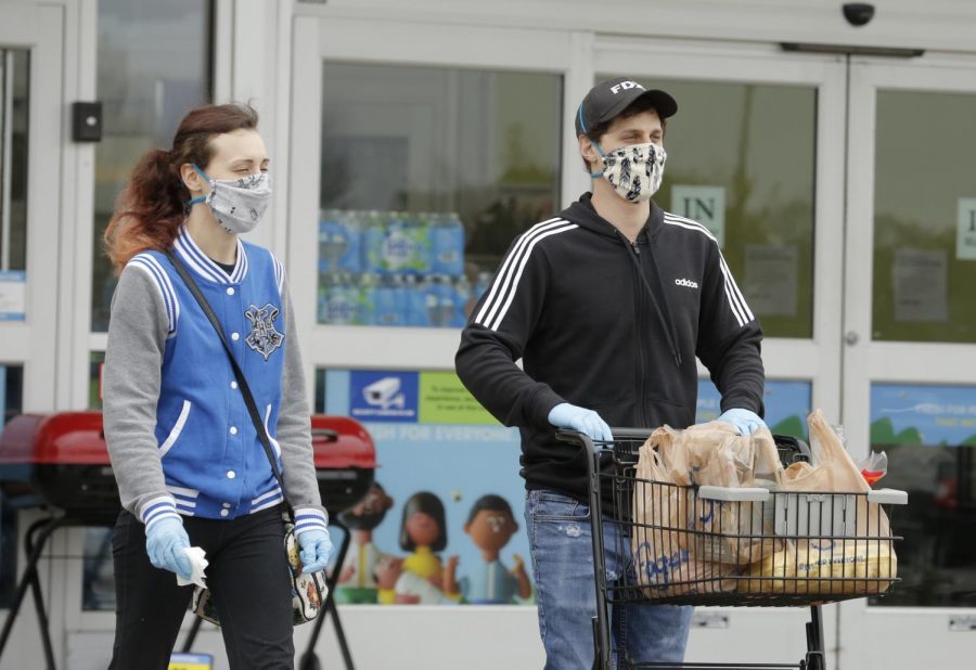 Shoppers leave Kroger supermarket, Carbondale, IL, Saturday, April 4, 2020.  Some shoppers opted to wear homemade medical masks, bandanas, or some other improvised facial covering to help protect against the Covid-19 pandemic.




(Angel Chevrestt, 646.314.3206)