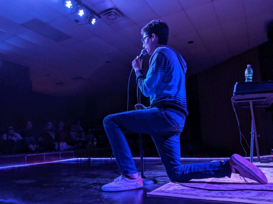 Liam Olendorf performs comedy at an open mic night at the Varsity Center in Carbondal.