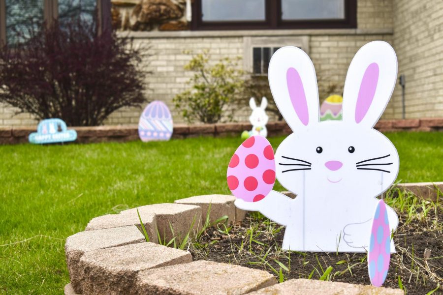 Easter decorations are set up on a front yard on Monroe Street in Niles, Illinois on Sunday, April 12. The Facebook group “Emerson Place Neighbors” requested families in the neighborhood to put up an Easter display so area children can have an egg hunt that follows social distancing guidelines.