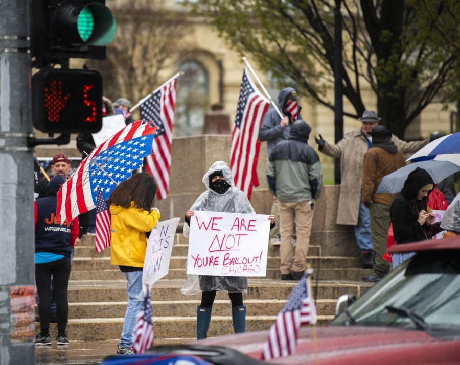 Orphans of the American Dream hosted the Reopen Illinois Rally in downtown Springfield where protesters displayed flags and signs supporting their disapproval towards the shelter-in-place order on April 25, 2020 at the Illinois State Capital Building. 