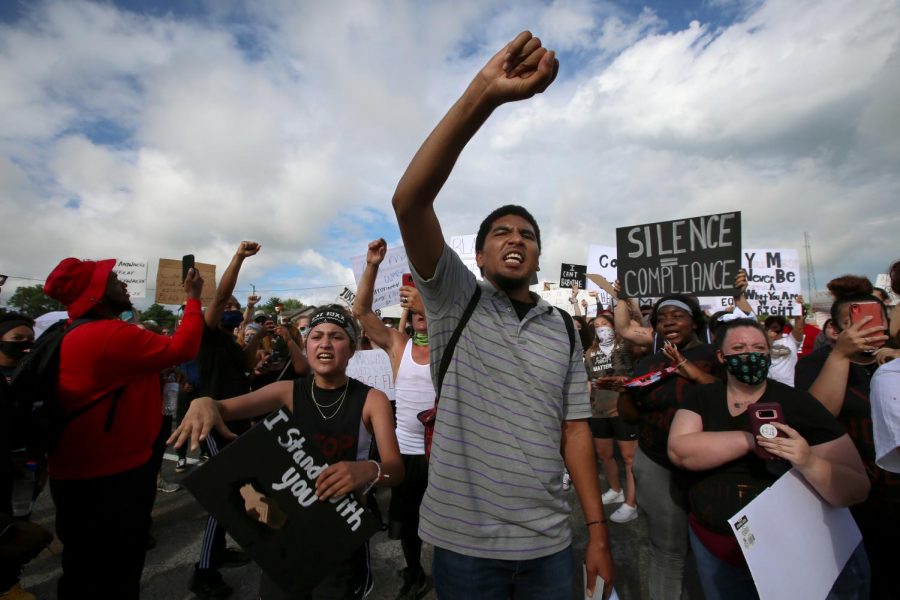 Janet Gomez, 18, left, of Cobden, IL and Aveon Winfield, 21, right, of Grand Chain, IL participate in a Black Lives Matter demonstration in the town of Anna, Illinois, Thursday, June 4, 2020.
