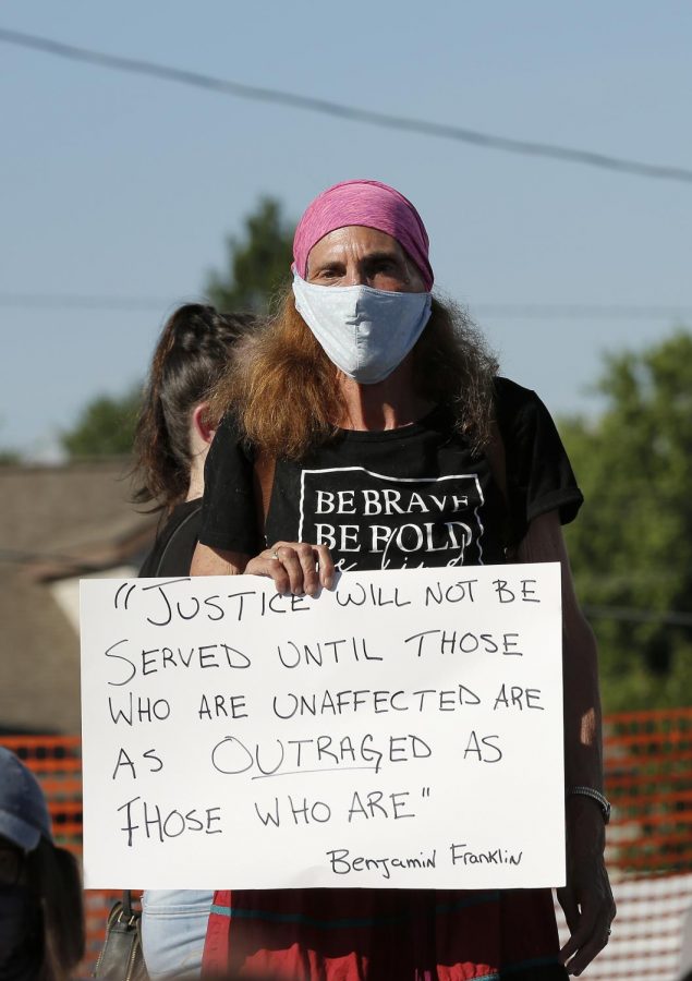 A Black Lives Matter demonstrator in the town of Anna, Illinois, Thursday, June 4, 2020.
About 150 Black Lives Matter demonstrators of all colors marched through the town of Anna, Illinois to protest the death of George Floyd in Minneapolis, as well as in the hopes of bringing more awareness to the issue of race relations in the United States, and especially the town of Anna.  The demonstration marked the first of its kind ever in this area of Southern Illinois.  Since the turn of the 20th century, Anna, IL has carried the grim reputation of being a sundown town - a product of the Jim Crow era, which meant African Americans werent allowed after dark.  Over time, A-N-N-A became known as an acronym that stood for: Aint No [N-word] Allowed.  Present day Anna is still viewed as one of the more racist towns in Southern Illinois, however there seem to be enough residents that would like to overcome this reality and allow for positive change to arrive and flourish.

Angel Chevrestt // @sobrofotos