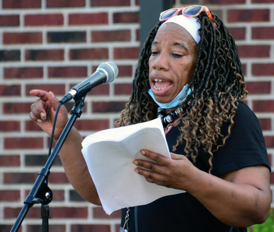 Nancy Maxwell reads a poem at the Blackout Tuesday event July 7. 2020, in Carbondale, ILL. The poem that Maxwell read is about being tired, she said, “I am tired of using things to make me lighter and whiter.”