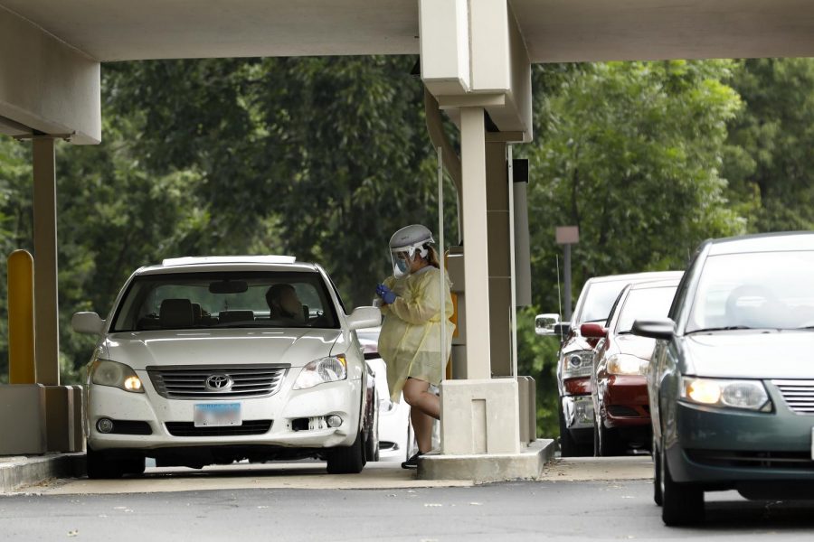 SIH staff wearing personal protective equipment perform Covid-19 tests at a drive-thru test site run by the SIH Memorial Hospital of Carbondale, located at the former Regions Bank building, Rt 13 and Poplar Street (500 W. Main Street), Carbondale, IL, Wednesday, July 29 ,2020.

Angel Chevrestt // @sobrofotos