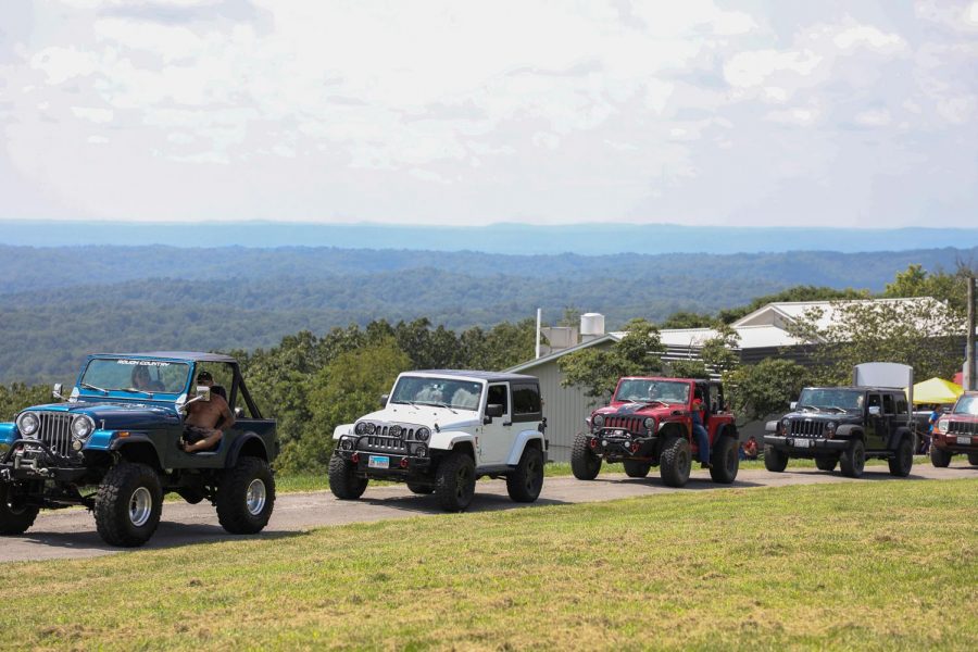 Jeeps from across the country line up to be guided to a parking spot at the Blessing of the Jeeps event at Bald Knob Cross of Peace  Aug. 15, 2020