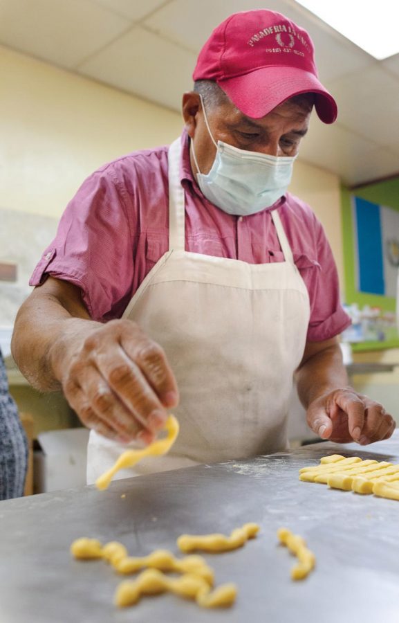 Domingo Valdez, 35, originally from Michoacán, Mexico, employee at La Unica Bakery preparing pastries, in Carbondale, ILL., August 27, 2020. 