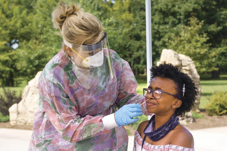 Amy Wright, nurse educator for the medical group at SIH, tests Araydiance Bell, 18, majoring in scenography, for COVID-19 at SIU, in Carbondale, Ill. Monday, Sept. 14, 2020. Bell said she was getting tested due to being around lots of people, so she wanted to make sure she did not have the virus. SIH will be offering COVID-19 testing on campus on Mondays from 8:30 a.m. - 3 p.m. at the Becker Pavilion near the Campus Lake boat dock and Wednesdays from 10 a.m. - 4 p.m. at the southwest corner of Rinella Field across from the Student Health Center.