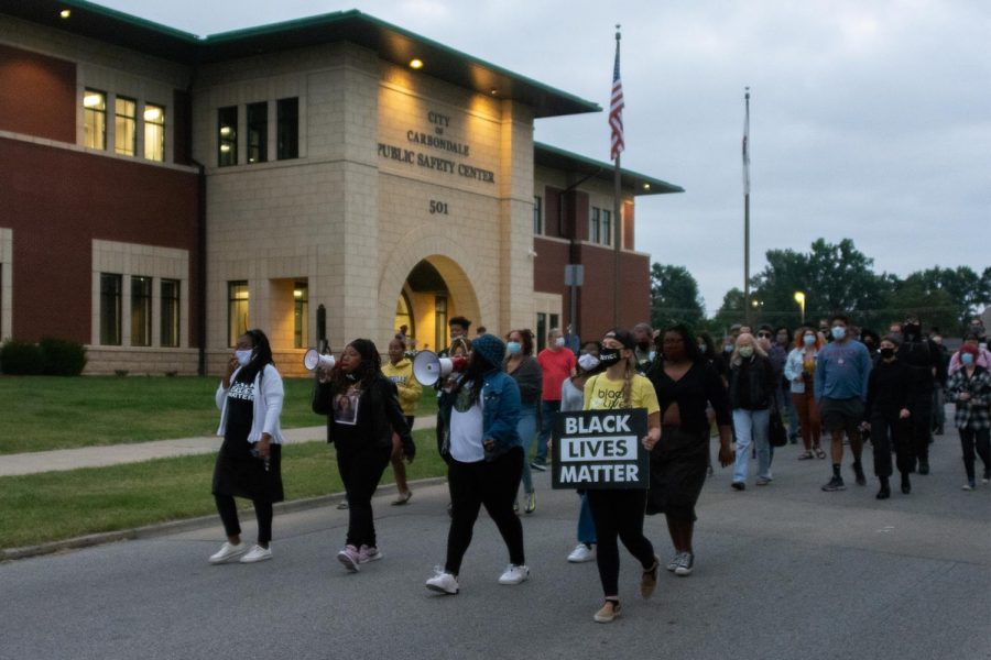 Chastity Mays, Nancy Maxwell, Emerald Avril and Elise Grabowska lead the march during a protest against the grand jury decision for the Breonna Taylor case on September 25, 2020, in Carbondale, ILL. 
