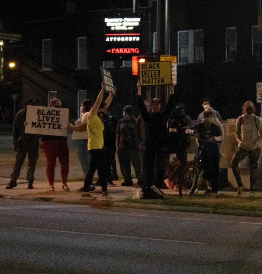 Protesters gather on the sidewalk in Carbondale Ill. on September 25, 2020.