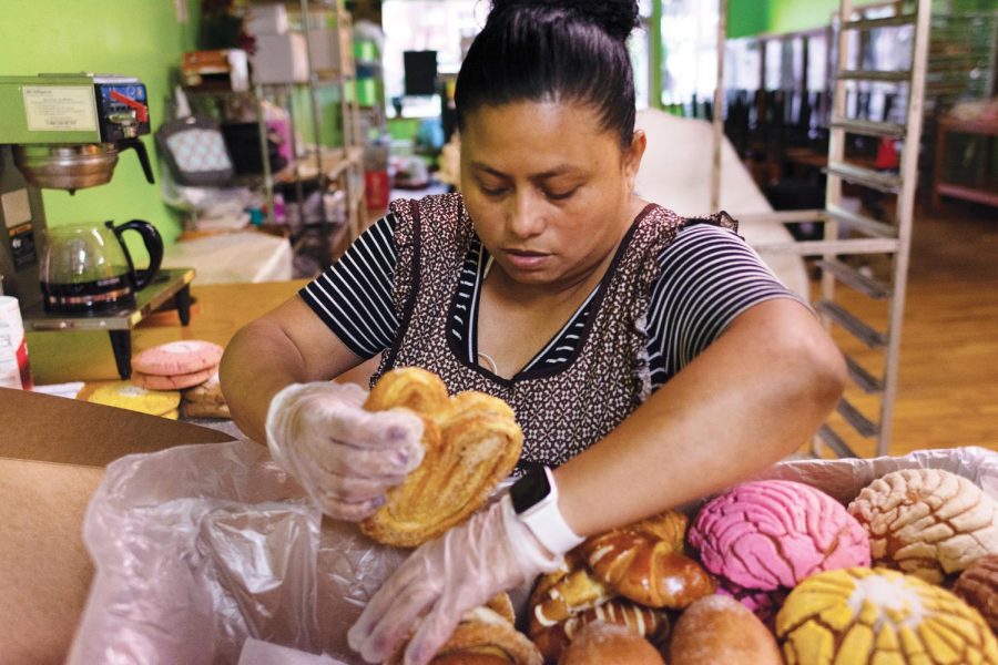 Dáris Herrera, 39, owner of La Unica Bakery, prepares an order to be picked up, August 27, 2020. 