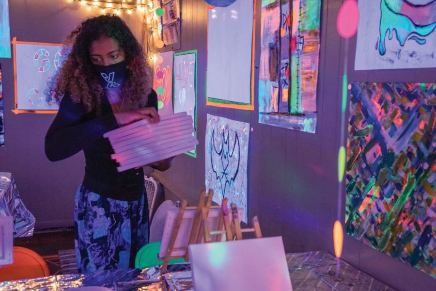 SIU alumna, Cree Sahidah Glanz, hands out blank canvases at Project Human X on Sept. 22, 2020.