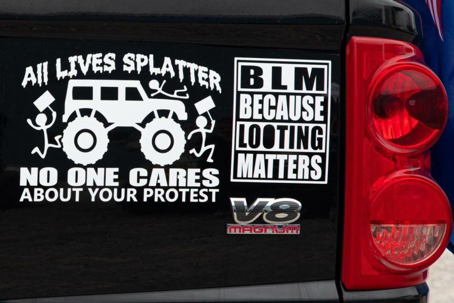 Anti-Black Lives Matter decals are displayed on a truck at the Trump Train event in Anna, Ill., on Saturday, Oct. 10, 2020.