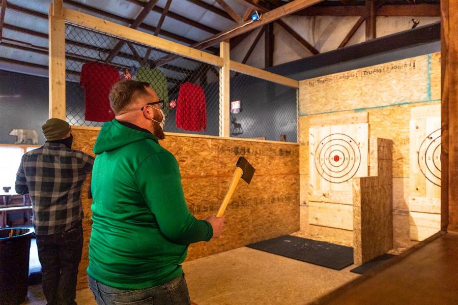Matt Ahlfield and Isaac Gibson, co-owners of Backwoods Axe Throwing in Murphysboro, practice their axe throwing Thursday, Oct. 29, 2020. 