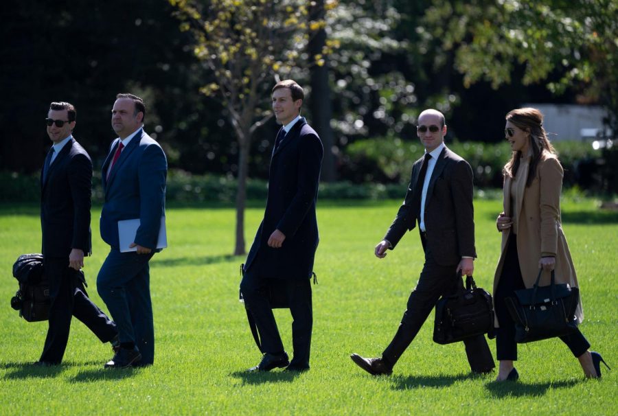 In this file photo, (L-R) Assistant to the President and Director of Oval Office Operations Nicholas Luna, Assistant to the President and Deputy Chief of Staff for Communications Dan Scavino, Senior Advisor to the President of the United States Jared Kushner, Senior Advisor to the President Stephen Miller, and counselor to President Hope Hicks walk to Marine One to depart from the South Lawn of the White House in Washington, DC on September 30, 2020. 