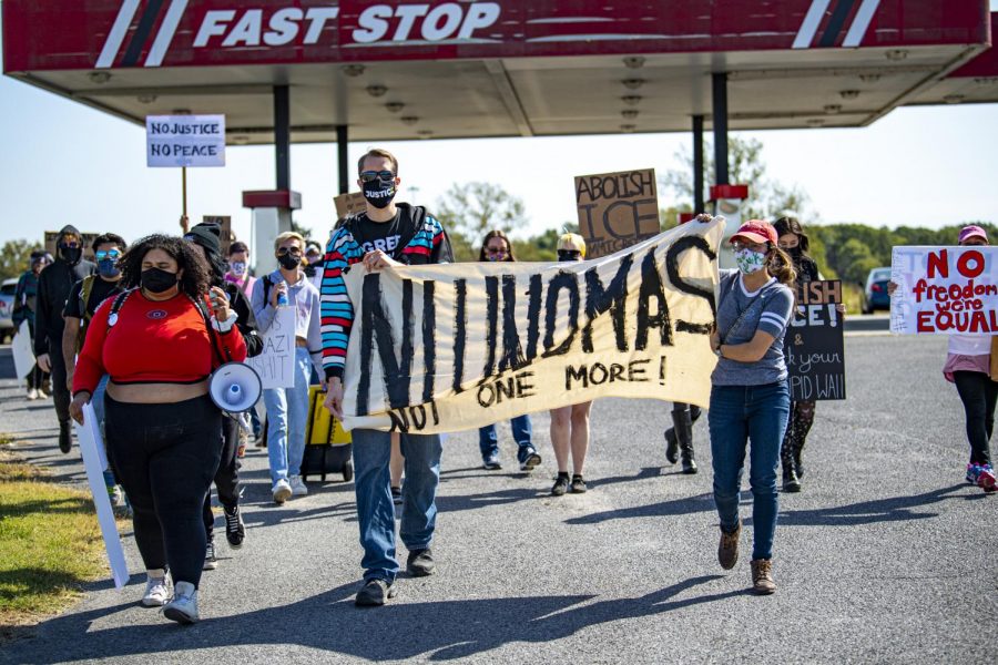 A group of protesters marches towards the Pulaski County Detention Center on Saturday, Oct. 3, 2020, in Ullin, IL. The facility is operated by ICE. The protest was put on by the Southern Illinois Immigrant Rights Project and Midwest Council for Civil Rights. The goal was to demand health inspections for inmates. 