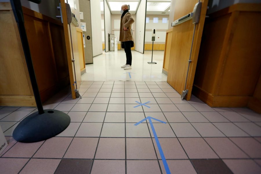 A voter waits to cast his ballot on election day at the Carbondale Civic Center, in Carbondale, Ill., Tuesday, Nov. 3, 2020.