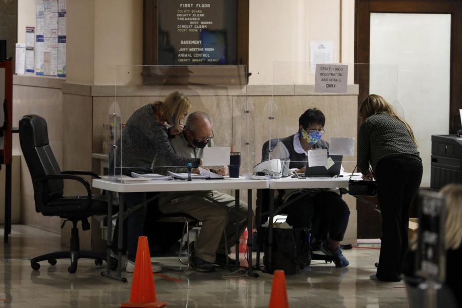 Poll workers help last-minute voters at the Jackson County Courthouse in Murphysboro on election day, Tuesday, Nov. 3, 2020.